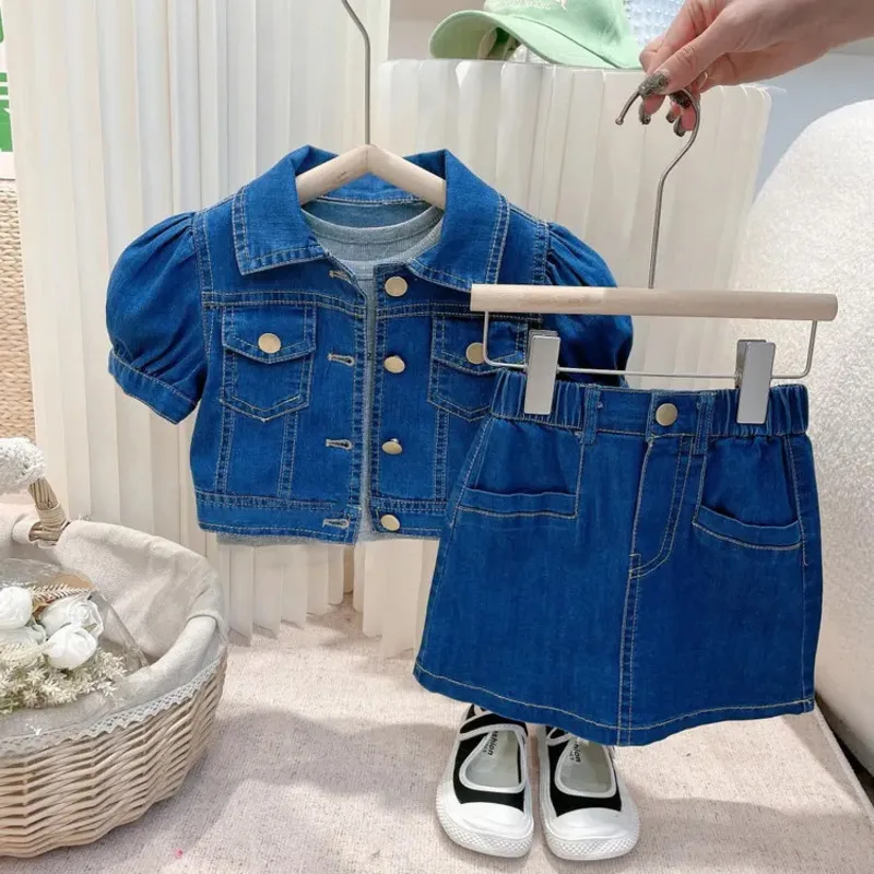 kf-Sfce0598bf4b64cd9ac7c7e9093ab8de86-New-Summer-Baby-Girl-Clothes-Children-Fashion-Shirt-Short-Skirt-2Pcs-Sets-Infant-Outfits-Toddler-Casual